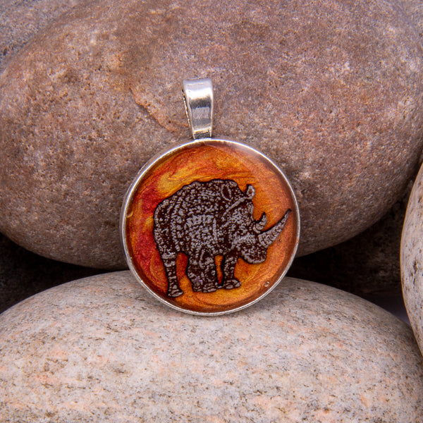 Handcrafted Bespoke Mighty Rhino Pendant; set in Silver Effect metal bezel.| Jabbawocky Crafts (jabbawockycrafts.co.uk)